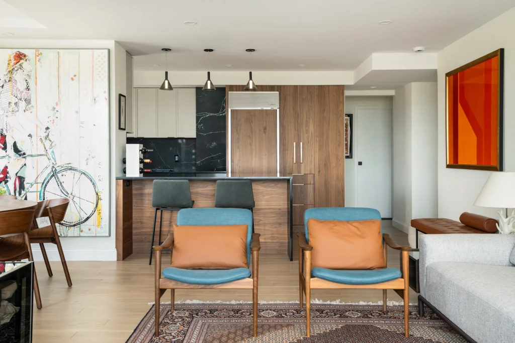 Open living room with vibrant art with walnut furniture