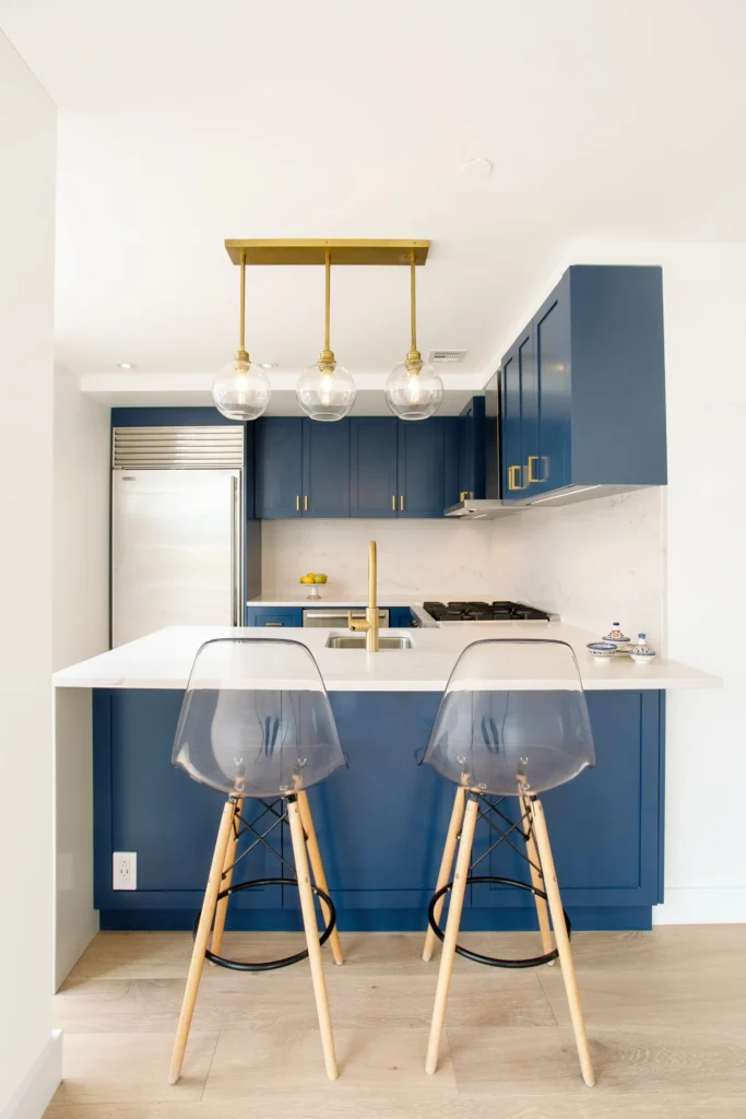 Custom blue color kitchen cabinets with brass pulls