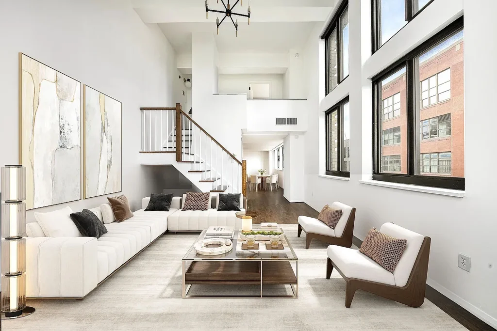 All white sectional with glass coffee table custom stairs