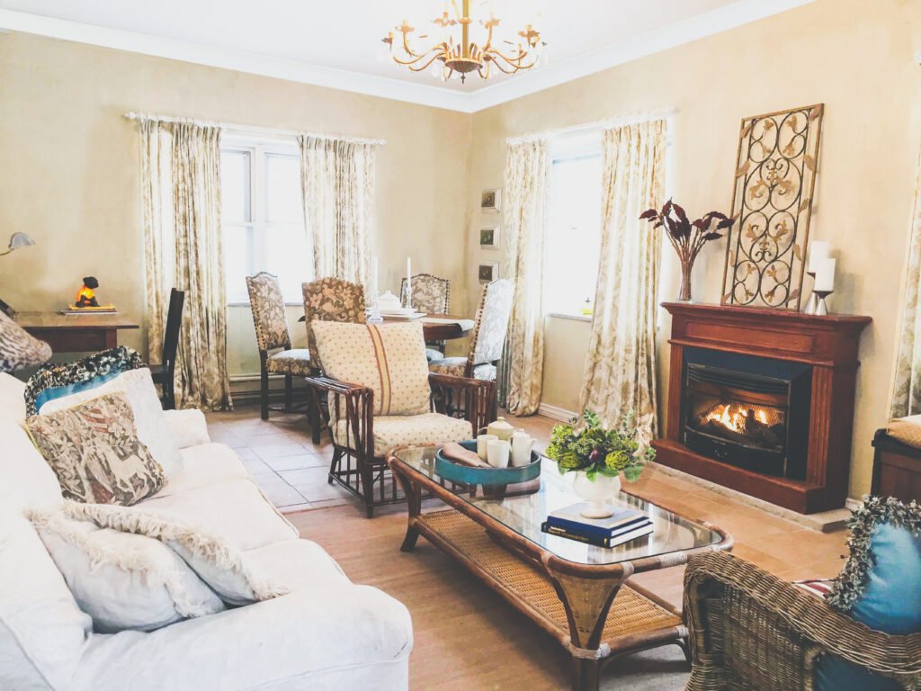 French country living room seating around the fireplace